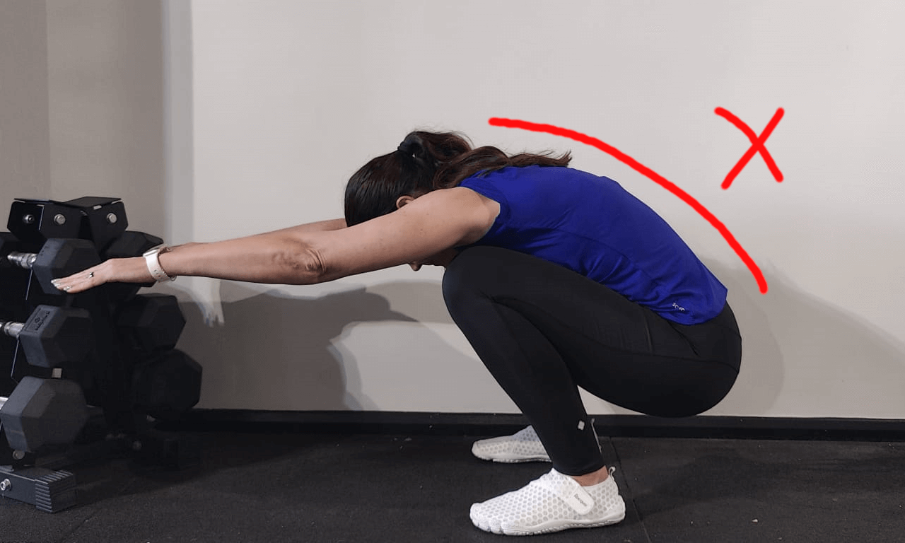 arched back during squat
