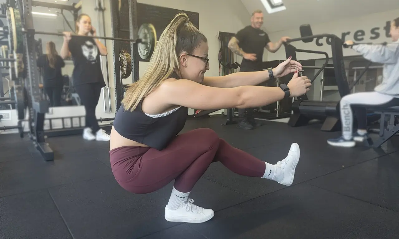 pistol squat demonstration at the bottom of the exercise